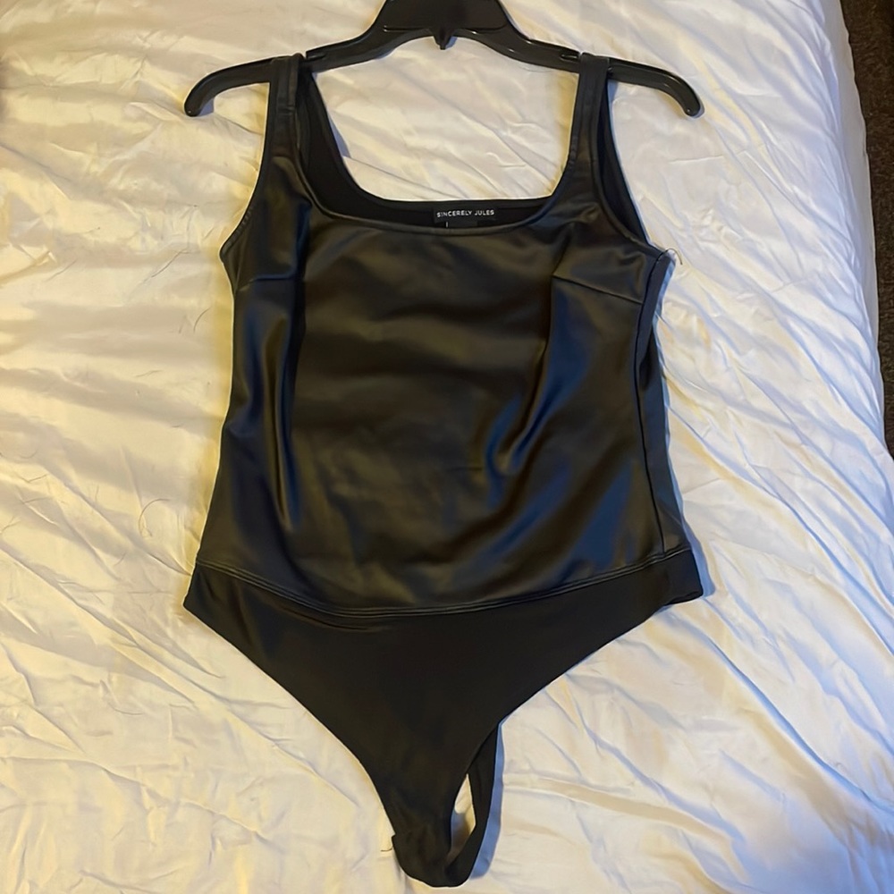 Small leather body suit.